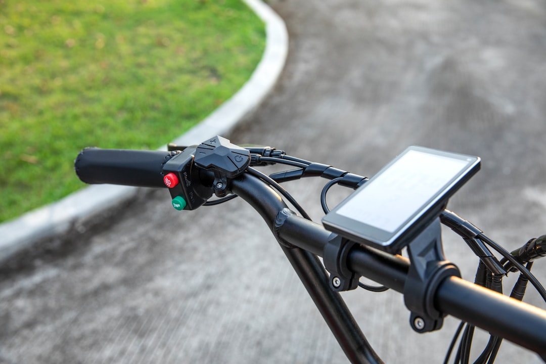 black bicycle handle bar on gray concrete floor